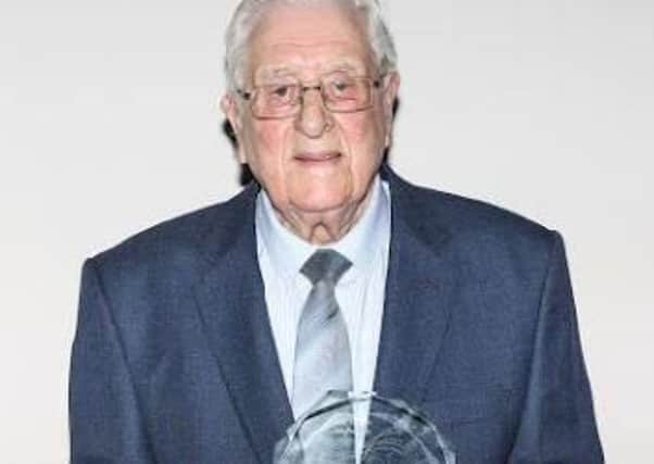 Albert Dooley, 92, with his award.