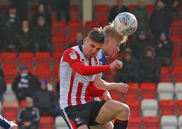 Picture by Gareth Williams/AHPIX.com; Football; Sky Bet League Two; Cheltenham Town v Chesterfield FC; 17/03/2018 KO 15.00; LCI Rail Stadium; copyright picture; Howard Roe/AHPIX.com; Chesterfield's George Smith leaps with Cheltenham's Kevin Dawson