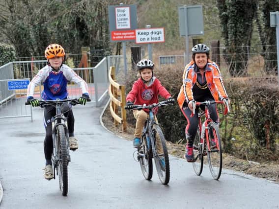 Ben and Jimmy Mellor with their mum Maresa, who is the Mayor of Darley Dale, put the new multi user trail to test after it's opening on Tuesday.