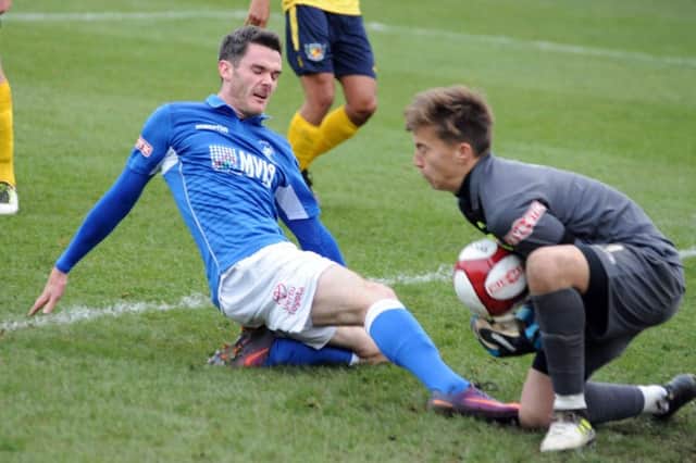 Matlock Town v Nantwich Town.
Ted Cribley challenges 'keeper William Jaaskelannan in the first half.