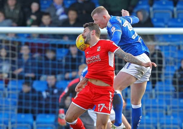 Picture by Gareth Williams/AHPIX.com; Football; Sky Bet League Two; Chesterfield FC v Swindon Town; 24/03/2018 KO 15.00; Proact Stadium; copyright picture; Howard Roe/AHPIX.com; Chesterfield's Alex Whitmore leaps with Swindon's Marc Richards