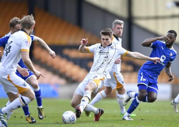 Port Vale's Charlie Raglan slides into a tackle: Picture by Steve Flynn/AHPIX.com, Football: Skybet League Two match Port Vale -V- Chesterfield at Vale Park, Burslem, Staffordshire, England on copyright picture Howard Roe 07973 739229
