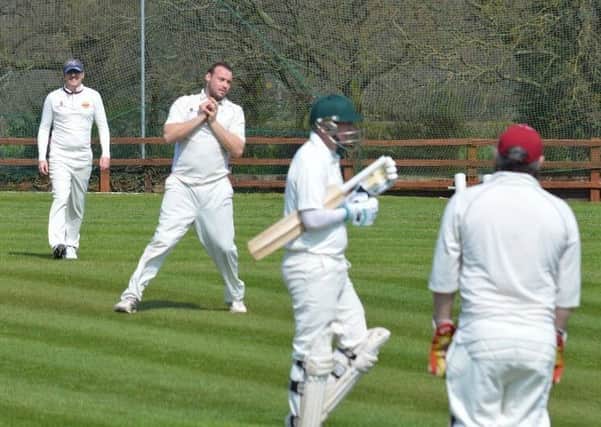 Holmewood bowler Jamie Horton completes a caught-and-bowled. (PHOTO BY: Carl Jarvis)
