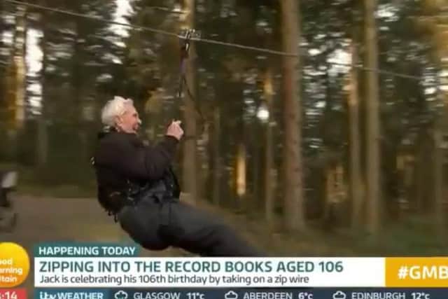 Jack Reynolds riding a zip wire on his 106th birthday. Picture: ITV.