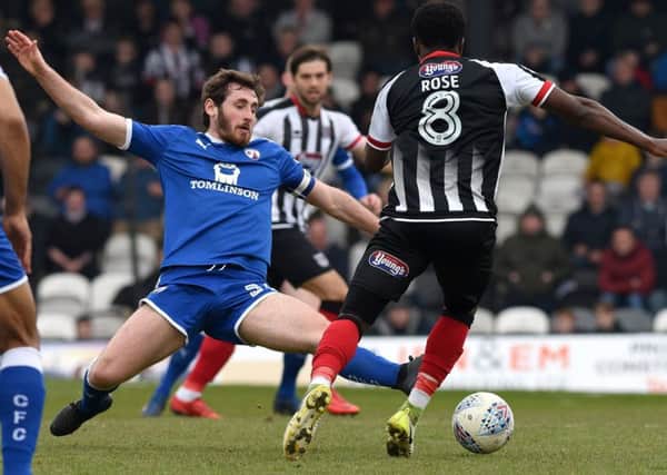 Picture Andrew Roe/AHPIX LTD, Football, EFL Sky Bet League Two, Grimsby Town v Chesterfield, Blundell Park, 07/04/18, K.O 3pm

Chesterfield's Jak McCourt tackles Grimsby's Mitch Rose

Andrew Roe>>>>>>>07826527594