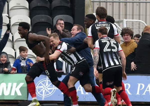 Picture Andrew Roe/AHPIX LTD, Football, EFL Sky Bet League Two, Grimsby Town v Chesterfield, Blundell Park, 07/04/18, K.O 3pm

Grimsby's fans and players celebrate Mitch Rose's winning penalty

Andrew Roe>>>>>>>07826527594