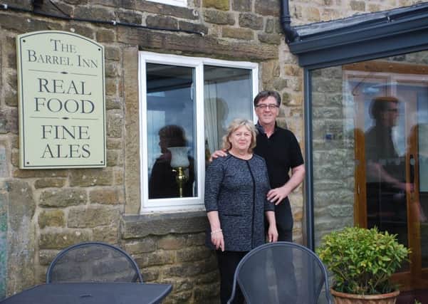 Diane and Phillip Cone outside the Barrel Inn, which has been able to  improve dining facilities for customers thanks to free business advice from Derbyshire Dales District Council