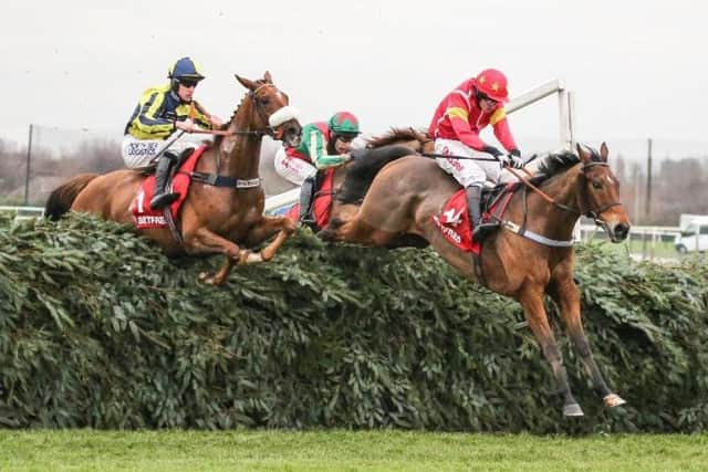 The Last Samuri (Ieft) and Vieux Lion Rouge (partially hidden) jumping the Aintree fences.