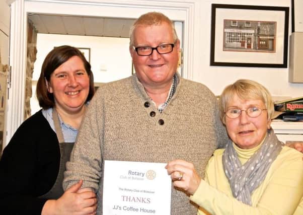 Leigh and Lorraine Holland  of JJs Coffee House  in Bolsover are presented with a certificate of thanks by Rita Reed, president of Bolsover Rotary Club.