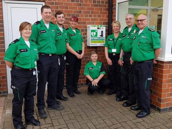 St John Ambulance volunteers with the new defibrillator.