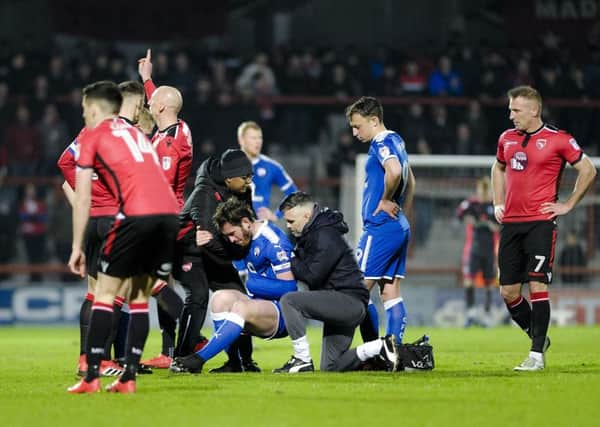 Picture by Howard Roe/AHPIX.com;Football;League One;
10/04/2018  KO  7.45pm; copyright picture;Howard Roe;07973 739229
                         
Chesterfield midfielder Jak McCourt is helped to his feet after suffering a suspected discolated shoulder during the match between Morecambe and Chesterfield.