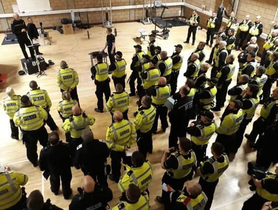 Police get a briefing ahead of the Spireites v Stags match later today