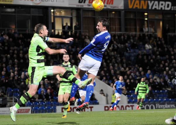 Chesterfield FC v Forest Green Rovers.
Kristian Dennis rises above the Forest Green defense.