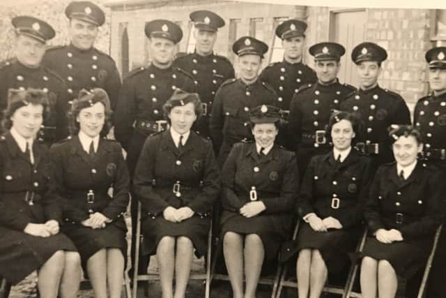 Doreen, third from left, is seen here with follow members of the fire service.