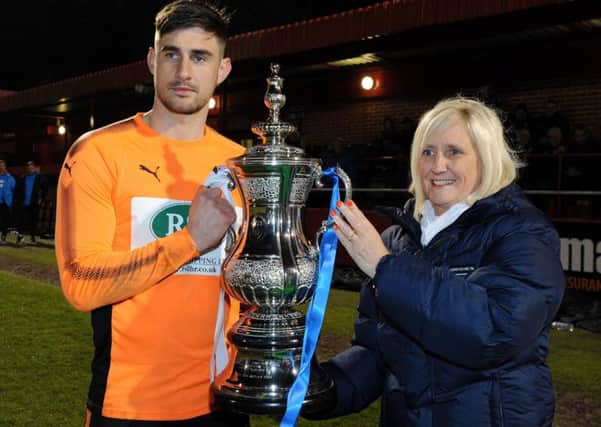 Alfreton Town v Chesterfield - Senior Challenge Cup Final 2017-18
Chesterfield's captain, Joe Anyon, is presented with the trophy by Dawn Heron, the chief executive of the Derbyshire F.A.