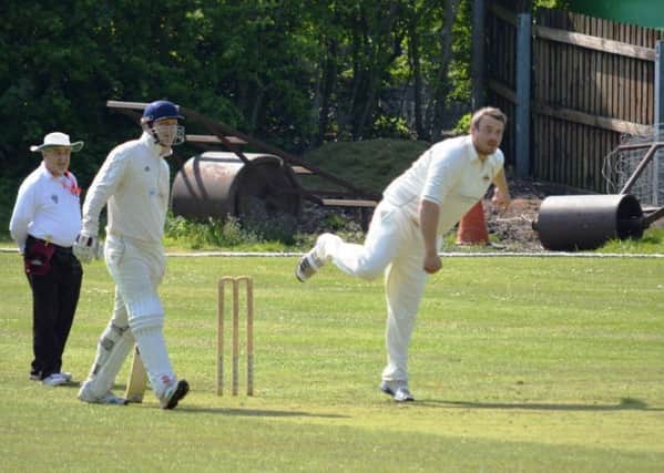 All-rounder Gavin Horton on his way to a five-wicket haul for Holmewood at Matlock. (PHOTO BY: Carl Jarvis)