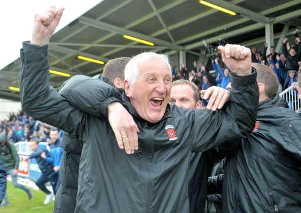 Hartlepool United manager Ronnie Moore celebrating with his staff at the end of the game against Exeter City which saw Pools retain their Football League status. Picture by FRANK REID