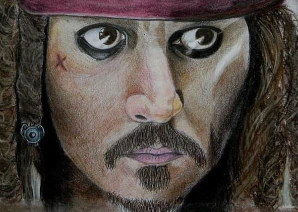 Featured is a portrait of actor Johnny Depp in his most famous role as Jack Sparrow from The Pirates of the Caribbean movies.