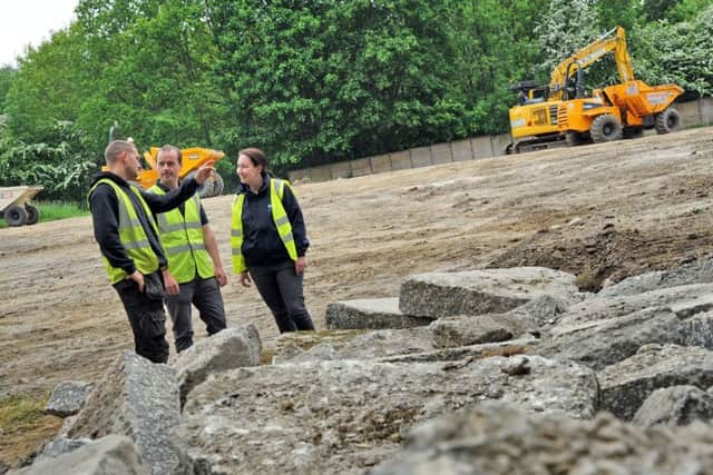 Chesterfield RSPCA branch manager, Rachel Gray and animal care manager Gary Taylor chat with site manager, Karl Wilson, at the site of their new building which has got underway at their Spital Lane centre.