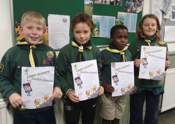 Joseph Cooper, Elliot Jones, Vuso Munaiwa and Sam Berriman from 1st Chinley Scouts with their Chief Scout Silver Awards.