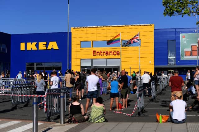 The socially-distanced queues began early, with some customers arriving at 5.30am in the hopes of being among the first to enter. (Credit: Getty Images)